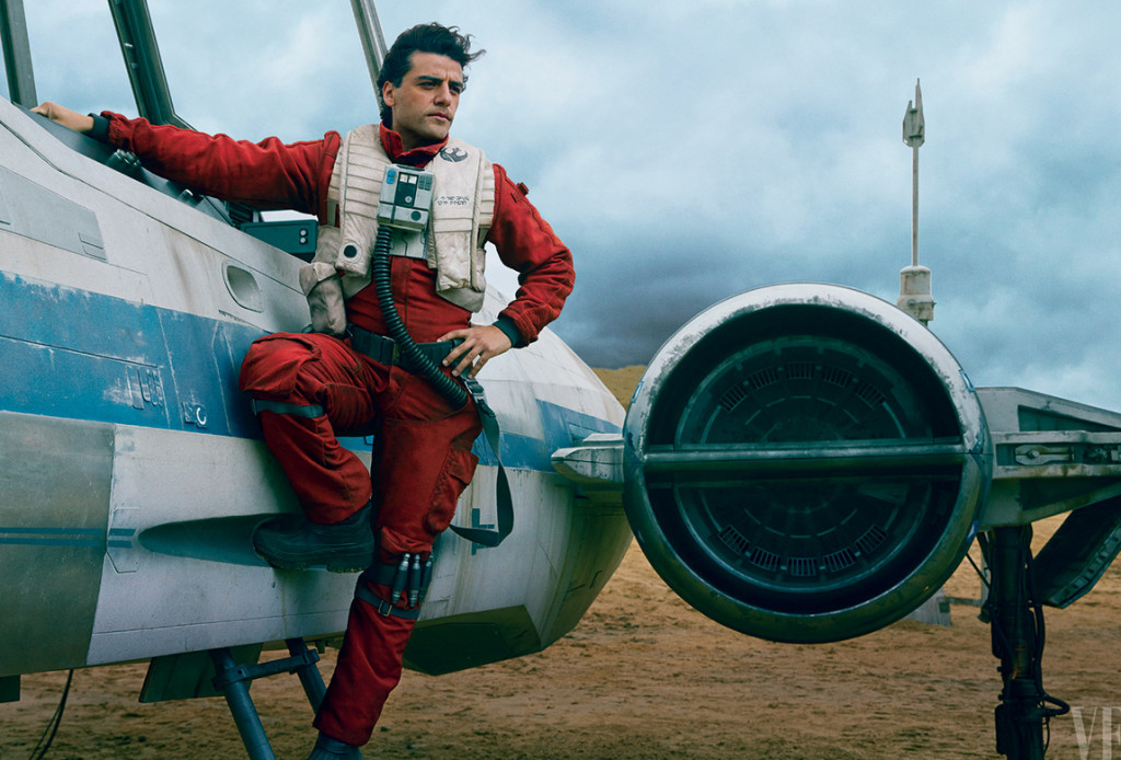 Dashing Resistance pilot Poe Dameron (Oscar Issac) stands alongside his trusty X-Wing fighter.